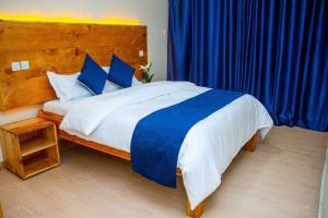 Postel nebo postele na pokoji v ubytování Keyman Address