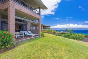 an image of a house with a lawn at 412 Ridge in Kahana +32 photos