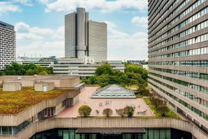 an aerial view of a city with tall buildings at The Westin Grand Munich in Munich +146 photos