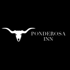a white goat with the words ponchoresias inc at Ponderosa Inn in Escalante