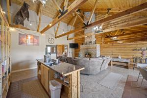 a living room with a couch and a fireplace at Ponderosa Inn in Escalante
