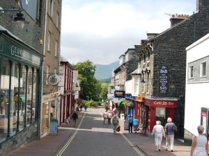 a group of people walking down a street in a town at 5 Balmoral House in Keswick +2 photos