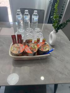 a tray of food and water bottles on a table at Together Stay Home in Mae Sai +5 photos