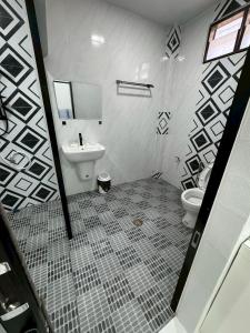 a bathroom with a sink and a toilet at Together Stay Home in Mae Sai