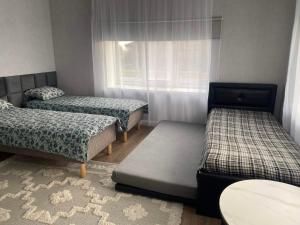 Ένα ή περισσότερα κρεβάτια σε δωμάτιο στο Mustvee aparts