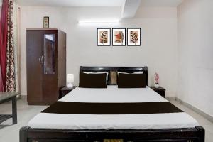 a bedroom with a large bed in a room at Hotel O Basera in Dalhousie