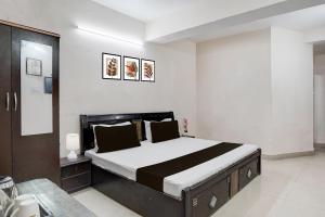 a bedroom with a large bed in a room at Hotel O Basera in Dalhousie