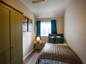 Ένα ή περισσότερα κρεβάτια σε δωμάτιο στο The Old Milking Parlour +3 φωτογραφίες