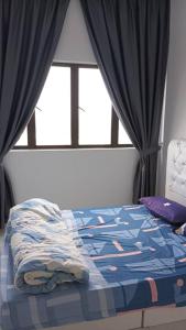 Ένα ή περισσότερα κρεβάτια σε δωμάτιο στο Youth City Residence, Nilai 2R2B