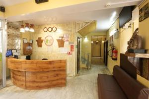 a restaurant with a wooden counter in a room at Harmony Sentiments in Jāmb