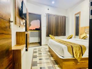 Ένα ή περισσότερα κρεβάτια σε δωμάτιο στο Hotel at Pichola Lake Nathi Ghat Brahmpole Udaipur