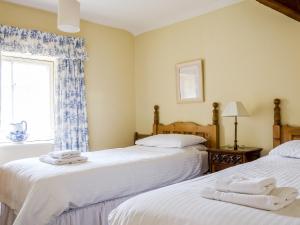 Postel nebo postele na pokoji v ubytování Bransdale