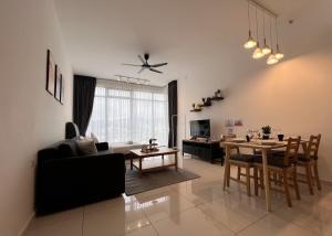 a living room with a table and a dining room at Georgetown#Beacon Executive Suite SkyPool#Modern & Elegant Suite# in George Town