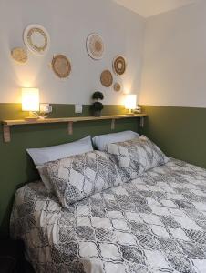 a bedroom with a bed with two pillows on it at Studio35 in Athens