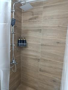 a bathroom with a shower with a glass door at Studio35 in Athens