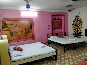 Ένα ή περισσότερα κρεβάτια σε δωμάτιο στο Golden dream guest house