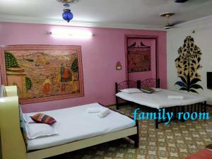 Ένα ή περισσότερα κρεβάτια σε δωμάτιο στο Golden dream guest house