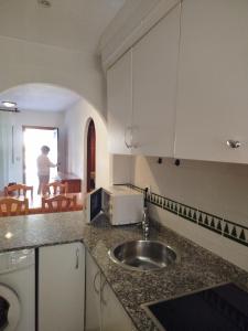 a kitchen with a sink and a counter top at TorrelagunaVera in Palomares