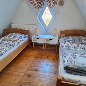 Ένα ή περισσότερα κρεβάτια σε δωμάτιο στο Willa Mewa