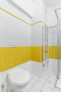 a bathroom with a toilet and a shower at Hotel CHOTOL in Horoměřice
