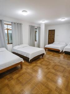 Ένα ή περισσότερα κρεβάτια σε δωμάτιο στο Hotel Pedernales MrRobert