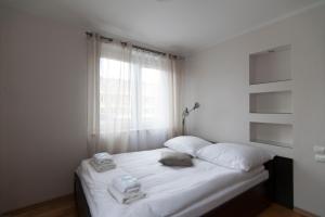 Apartamenty Białystok - Marii Skłodowskiej-Curie 6にあるベッド