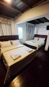 Postel nebo postele na pokoji v ubytování The Venice Royal Bungalow Nuwaraeliya