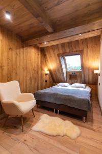 Ένα ή περισσότερα κρεβάτια σε δωμάτιο στο Ośrodek Wypoczynkowy Bernadetta