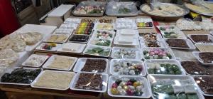a table topped with white trays filled with different types of minerals at Yeon Stay in Seoul
