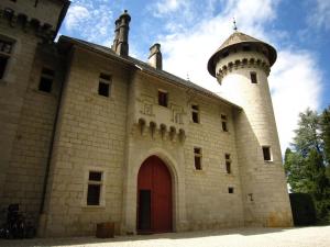 a building with a lighthouse on top of it at Charming Castle in Serrières-en-Chautagn with Pool in Serrières-en-Chautagne