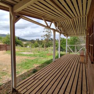 Zahrada ubytování Cabañas Hualles de Huillinco + 2 fotografie