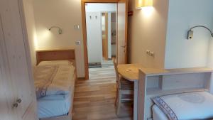 En eller flere senge i et værelse på Mansarda Dolores