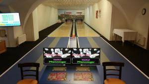 an empty bowling alley in a gymnasium with at Gasthof Pflamminger in Wörth an der Donau