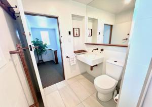 a bathroom with a toilet and a sink at Top of Tyne - Peace, Comfort & Local Connection in Oamaru +10 photos