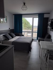 En eller flere senge i et værelse på Gwiazda nad Horyzont