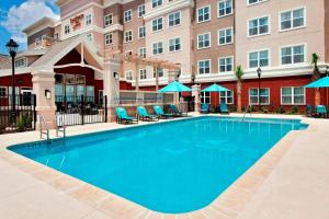 a large swimming pool in front of a hotel at Residence Inn by Marriott Atlanta Peachtree City in Peachtree City