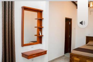 Postel nebo postele na pokoji v ubytování Nade Villas Galle