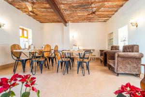 a living room with a table and chairs and a couch at The Munshi Mansion in Jodhpur