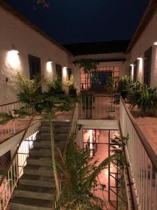 a staircase leading to a building at night at Siki Hotel in Saint-Louis +7 photos