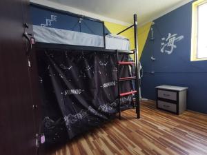 Postel nebo postele na pokoji v ubytování Harmony Backpackers Hostel