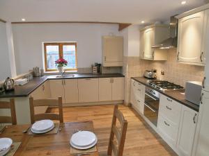 Køkken eller tekøkken på The Street Farm Barn