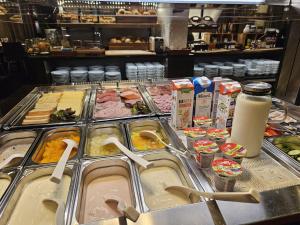 a buffet line with many different types of food at CONTEL Hotel in Koblenz
