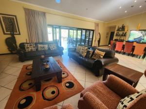 Et opholdsområde på Luxury Private Villa - Golf Estate & Leisure