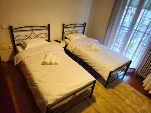 Ένα ή περισσότερα κρεβάτια σε δωμάτιο στο Calliope's Home