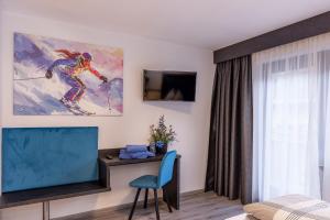 TV a/nebo společenská místnost v ubytování Sieglinde Color