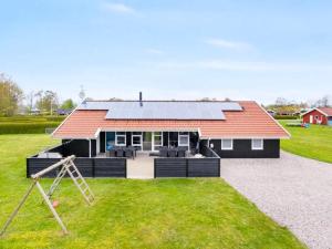 a house with solar panels on the roof at 5 star holiday home in Nordborg in Nordborg