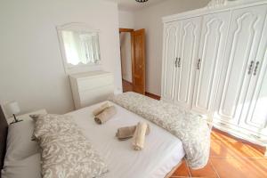 En eller flere senge i et værelse på Casa Centro Los Remedios