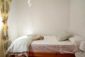 En eller flere senge i et værelse på Casa Centro Los Remedios