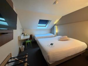 Postel nebo postele na pokoji v ubytování Campanile Epinay sur Orge Savigny Sur Orge