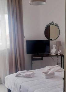 Ένα ή περισσότερα κρεβάτια σε δωμάτιο στο GF AXD Apartment